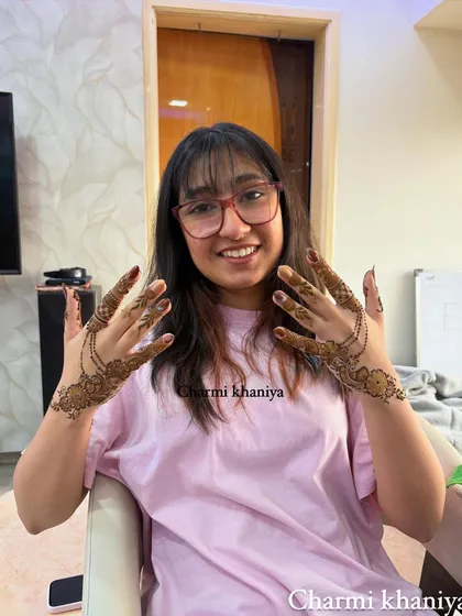 Another shot of this happy client! The two hands together show the beautiful symmetry of the jewellery-inspired design.