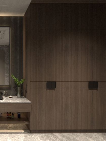 Another view of the villa bathroom, focusing on the custom wardrobe with integrated handles and its relationship to the vanity area. The design is all about clean lines and rich textures.