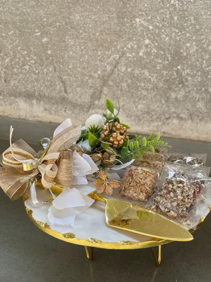 Our hampers carry more than just goodies; they carry thought and a touch of magic. This arrangement on a marble stand is perfect for weddings, thank yous, or any moment that deserves to be special.