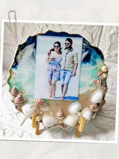 Bring your beach memories home with a custom ocean themed photo frame. I use real seashells, sand textures, and flowing blue and white resin to capture the feeling of the sea, creating the perfect display for your favorite vacation photo.