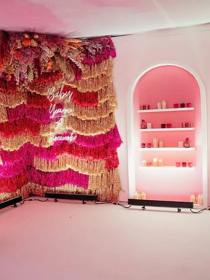 Photo corners should be more than just a backdrop; they should be an experience. For a "Fireworks" themed industry event, I designed this multi-textured installation with tinsel, neon, and lyrical art to create a vibrant, Insta-worthy moment that was a story in itself.
