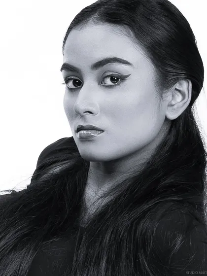 A sharp, high-contrast black and white headshot. This type of clean, direct portrait is essential for any professional model or actor's portfolio.