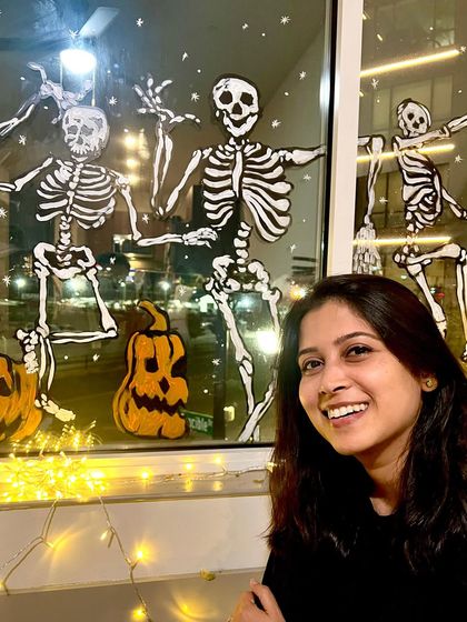 Getting into the spooky spirit! Here I am with a fun Halloween window display I painted. We love incorporating art into every part of life, especially holidays.