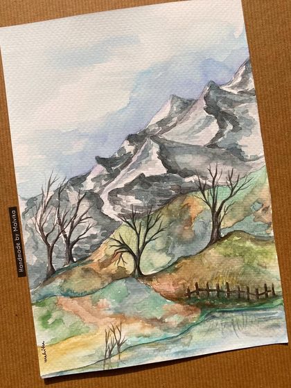 The full view of my winter watercolor landscape. This painting captures the serene and patient feeling of a mountain winter, with bare trees standing against the snowy peaks.