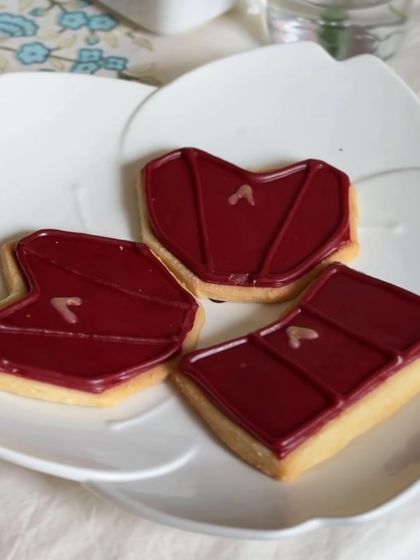 A close-up of our custom cookies for a brand collaboration, showcasing the different shapes we created. Each one is a buttery sugar cookie topped with smooth, custom-colored royal icing.