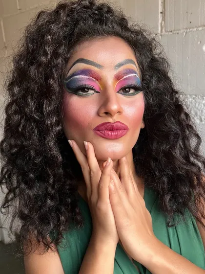 The complete transformation, with dramatic lashes and bold lips, is a testament to our student's skill.