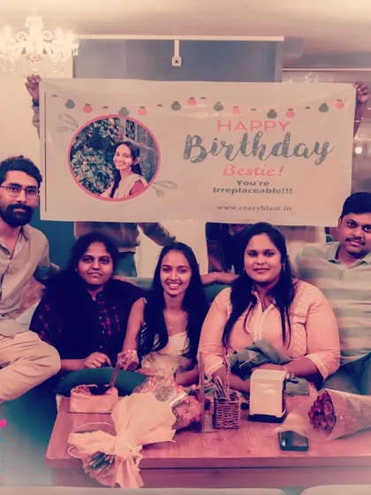 Surprising your bestie is our favorite thing to do. This happy group shot was taken right after we ambushed their friend with a birthday flashmob, complete with flowers and a personalized banner.