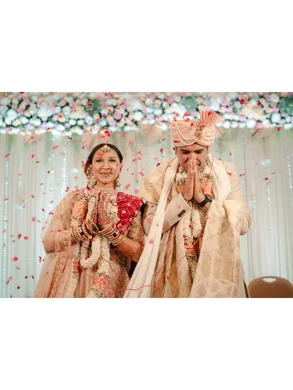 With hands joined in respect and gratitude, the couple thanks their guests. This is a moment of humility and grace that we love to capture.