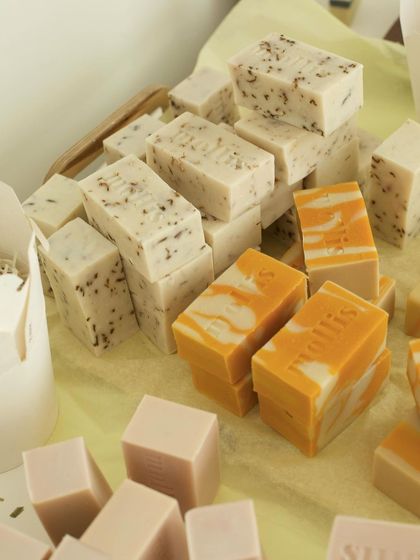 More soaps from the cutting table, including exfoliating bars and vibrant orange swirls.