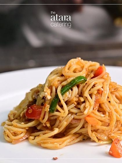 The final product: a delicious plate of freshly made Teppanyaki noodles. Each dish is customized and served immediately, ensuring maximum freshness and taste.