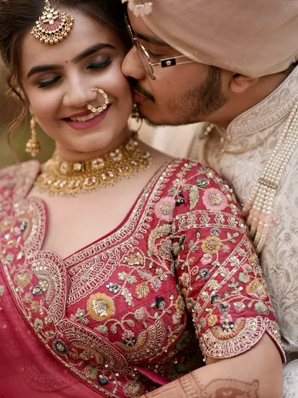 An intimate moment captured perfectly. The bride's glowing skin and defined eyes are the focus in this beautiful close-up.