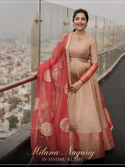 A stunning shot of Milana Nagaraj in our custom Anarkali, with the city skyline as her backdrop.