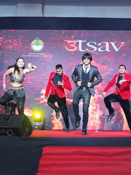 My male and female dancers in a high-jump choreographed move, showcasing their athleticism and skill.