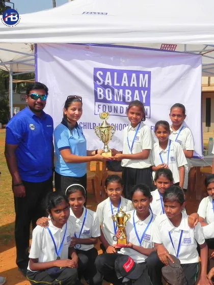 Our team presenting a trophy to the winners from the Salaam Bombay Foundation. Our NGO partnerships create invaluable opportunities for growth and development through sports.