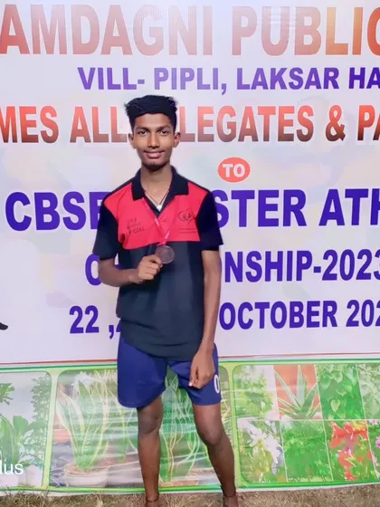 A proud athlete with his CBSE Cluster Athletics bronze medal.