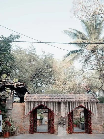 The entrance to the Bandstand area, decorated with pastel-colored flowers, setting a soft and romantic tone for the wedding.