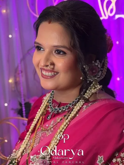 Another smiling shot from the baby shower. The lighting highlights her dewy skin and the beautiful details of her jewelry.
