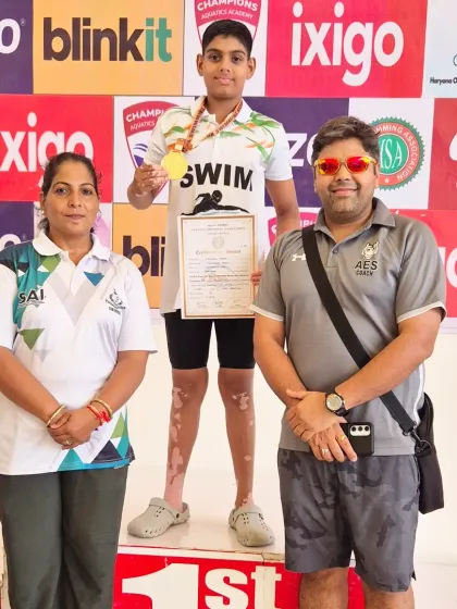 Standing with my swimmer Ujjwal and his mother on the podium. Family support is a critical part of our success story.