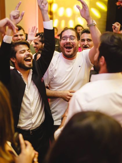Pure, unadulterated joy. The groom and his friends celebrating on the dance floor after their performance.