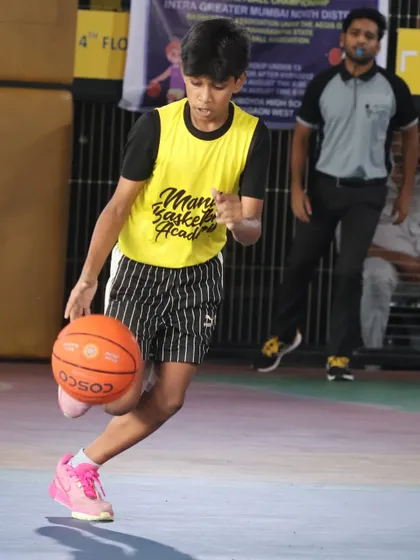 A young player dribbles with speed and control. Our drills are designed to improve agility and confidence with the ball.