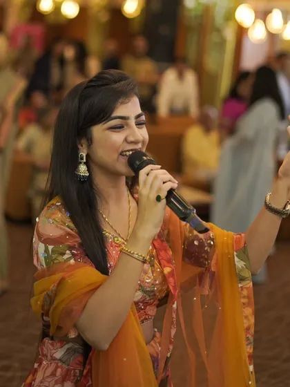 A happy, smiling shot of me singing at a wedding event. I truly love what I do.