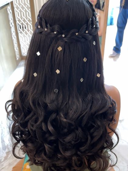 A close-up of the curls and mirror accessories, showing the detail and craftsmanship of this unique hairstyle.