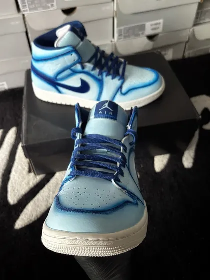 A front view of the blue cartoon custom Jordans.