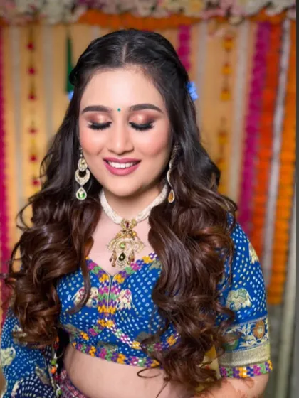 The bride looking happy and beautiful with her unique floral hairstyle.