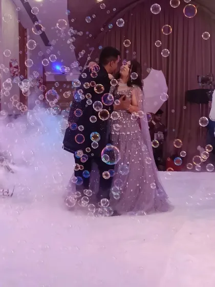 That perfect, magical moment. A dreamy couple's dance surrounded by bubbles and smoke during their ring ceremony. As your host and celebration partner, I work behind the scenes to help create and capture these picture-perfect memories you'll cherish forever.