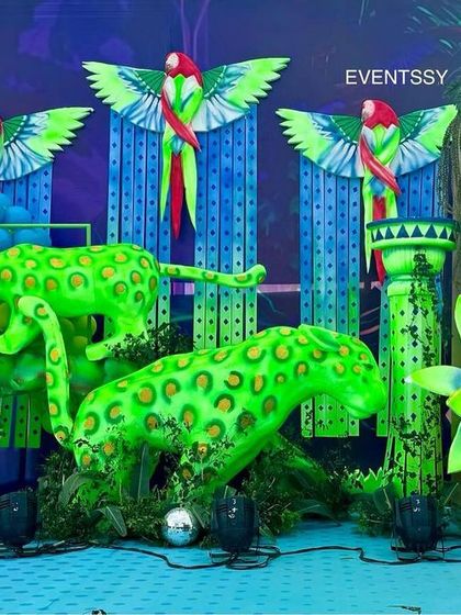 A close-up of the neon green leopards and giraffe, showing how lighting can completely transform the party atmosphere.