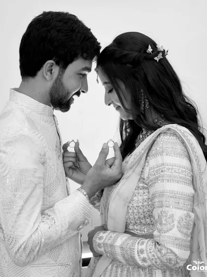 Sometimes, the most powerful moments are the simplest. This black and white photo focuses on the rings and the quiet joy of a new beginning, creating a timeless memory.