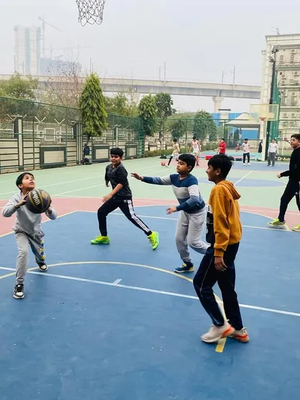 A young player learns to pass the ball effectively in a game situation.