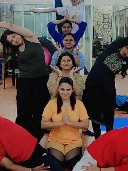 A creative group pose by our first batch of certified Prenatal Yoga teachers. This pyramid formation symbolizes the support and strength they will offer to expecting mothers.
