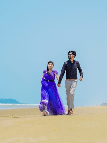 A casual walk on the beach. This couple looks effortlessly stylish in their pre-wedding shoot, with the blue gown adding a beautiful pop of color.
