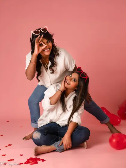 These two sisters celebrated Valentine's Day with a fun-filled shoot for themselves. Their contagious energy and laughter made this session an absolute joy, and the heart-shaped glasses were the perfect touch.