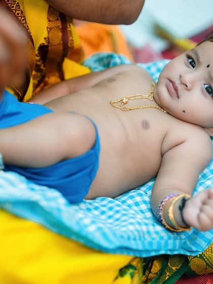 A sweet portrait of the baby during their naming ceremony. Even with all the activity, I find moments to capture your baby's calm and curious expressions.