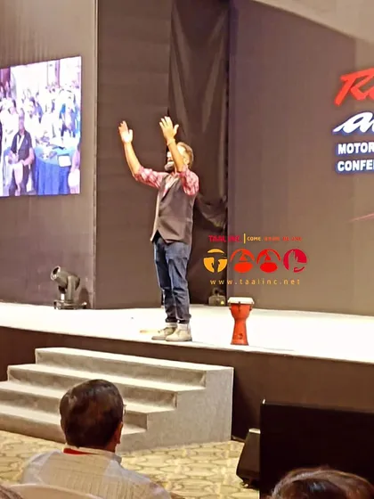 Another shot of Aman commanding the stage. Notice his posture and energy. A key part of our training is developing stage presence and the confidence to lead large groups.