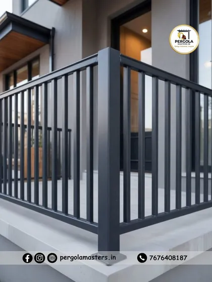 A close-up view of a corner section of a modern black balcony railing. The image highlights the clean joints and durable powder-coated finish, showcasing the quality and precision of our fabrication.