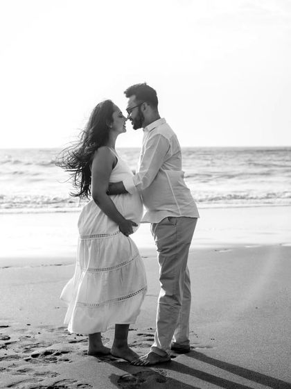 A romantic and windswept moment on the beach, captured in beautiful black and white. This edit gives the photo a timeless, classic feel, focusing entirely on the couple's connection.