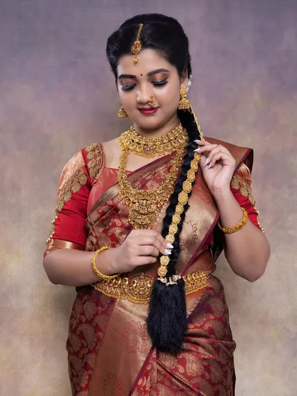 Another shot of my student's work, showcasing the traditional hairstyle and full look. I am proud to guide aspiring artists.
