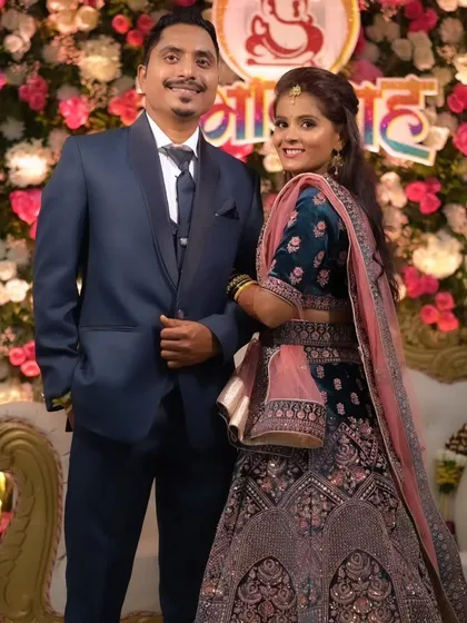 A happy, smiling portrait of the newlyweds.