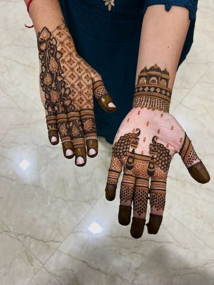 This image shows two different styles I offer: one hand with an intricate floral jaal pattern, and the other with a simpler, elegant peacock design.