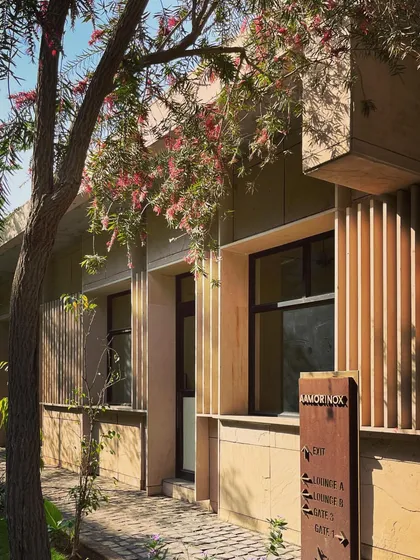 The guard rooms for a residential complex. Even in small, functional structures, we focus on material quality and thoughtful design, using sandstone and wooden louvers to create a welcoming entrance.