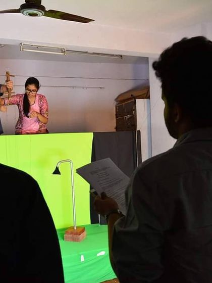 Our director overseeing a shot during a green screen filming session. We are always exploring new ways to tell stories.