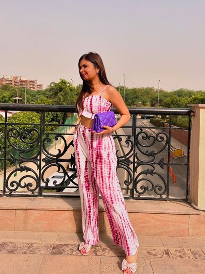 Another shot of the tie-dye set, showing off the full look and the matching purple bag.