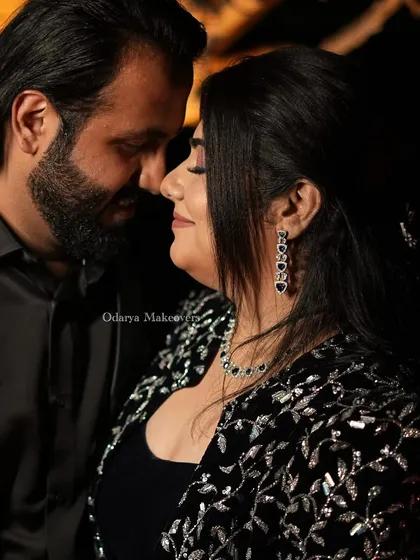 An intimate couple portrait from their cocktail party. I created a sophisticated look for the bride with smokey eyes and a nude lip that complemented her elegant black embellished jacket.