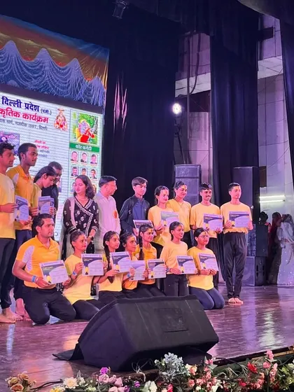 The Anubhuti Yog team proudly posing with their certificates after a successful performance. It's a moment of celebration for their hard work and dedication.