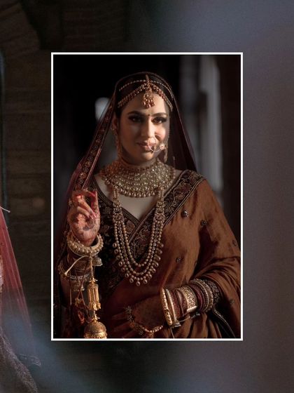 A classic bridal portrait, with the bride's face framed by her veil, her expression serene and beautiful.