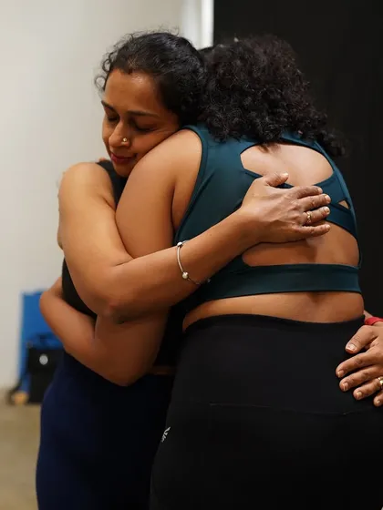 A heartfelt hug shared between two participants captures the spirit of sisterhood and safety we cultivate in our women's circles. It is in these moments of genuine connection and vulnerability that true healing and support are found.