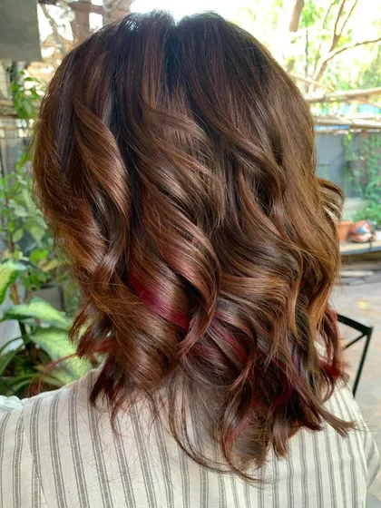 A side view of the 'Spiced Brown Sugar Apple' look. The hints of red add a fun and fiery element to the brown base.